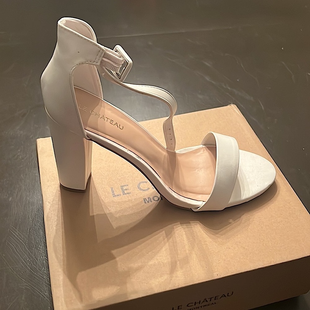 Brand new in box Le Chateau white heels, sandals. Size 10